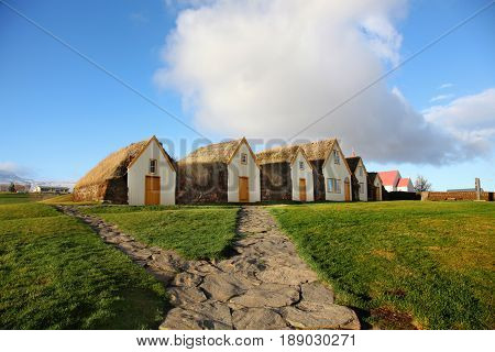 Row of traditional turf houses in Gaumbaer Iceland