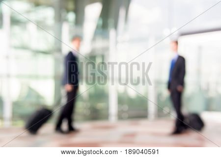Blur businessmen with luggage at the airport for background