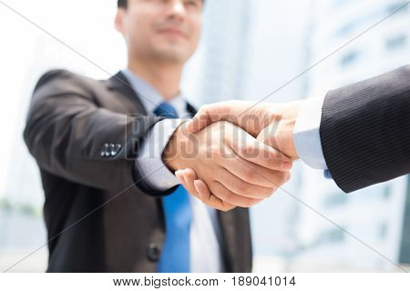 Businessman making handshake - success dealing greeting & business partner concepts