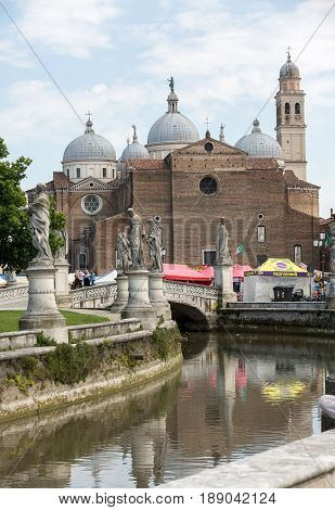 PADUA ITALY - MAY 3 2016: view of Prato della Valle and Basilica of Santa Giustina. Abbey was founded in the fifth century on the tomb of saint Justine of Padua in Padova Italy