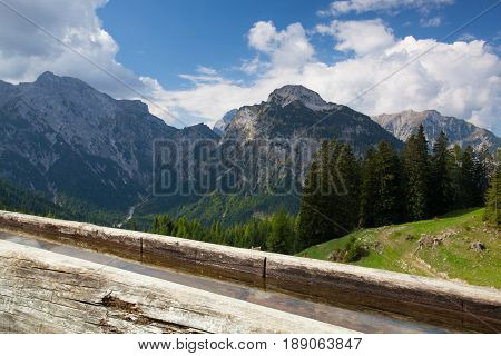 Rural scenery with wooden water well.Achensee Lake area Austria Tirol.