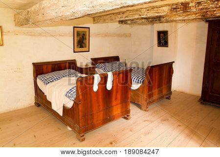 Ballenberg Switzerland - 23 September 2006: Interior of a vintage cottage - bedroom in a house at Ballenberg a Swiss open-air museum in Brienz Switzerland