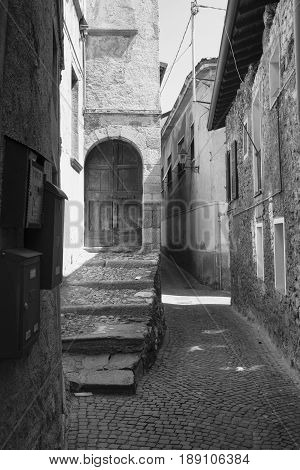 Asso (Como Lombardy Italy): typical street in the historic town. Black and white