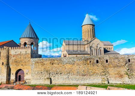 Panoramic view of Alaverdi orthodox monastery in Kakhetia region in Georgia and snow peaks of Caucasus mountains