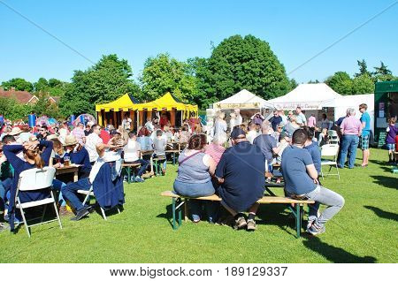 TENTERDEN, ENGLAND - MAY 21, 2017: People enjoying the Food and Drink Festival at Tenterden in Kent. The festival was held for the first time in 2017 and hopes to become an annual event.