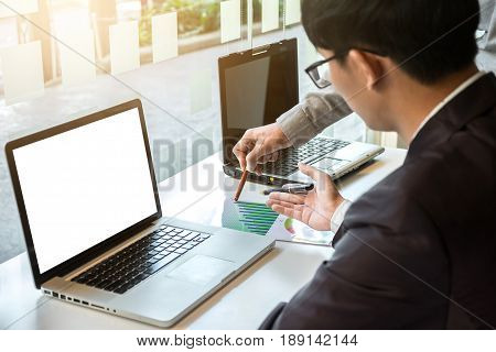 Two businessteam looking at report and having a discussion in office. business concept.
