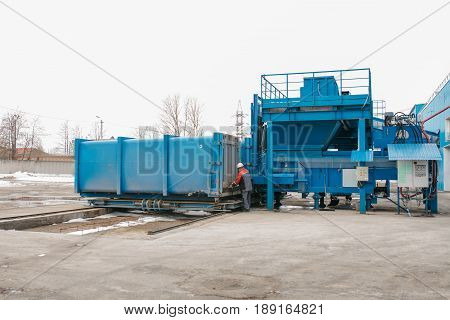 Preparation of a container with waste for subsequent transportation to a waste disposal plant. Waste processing plant. Business for waste sorting and processing. Cargo.