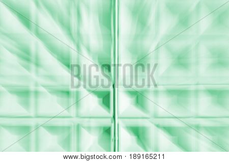 Abstract motion blur background of greenconcrete wall with square cells geometrical pattern