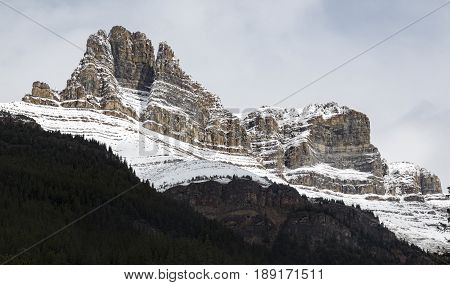 Stoic and snow-covered rock formations in Banff National Park Alberta Canada.