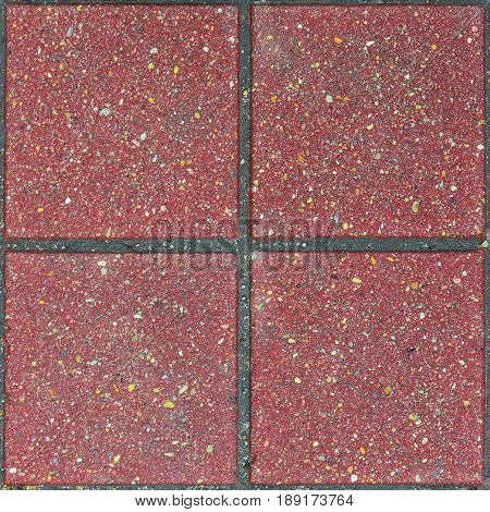 Red brick paving stones on a sidewalk. Abstract background texture
