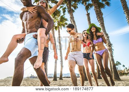 Multi-ethic group of people having fun on the beach