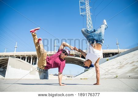 Two bbys ding some stunts - Street artist breakdancing outdrs