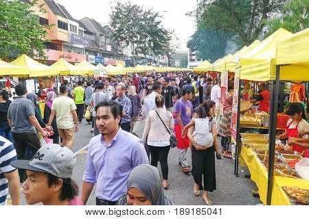 Kuala Lumpur, Malaysia, May 29, 2016: Muslim Shopper Buying Food From Street Vendor For Breaking Fas