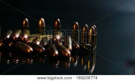 9mm bullets on the black mirror background