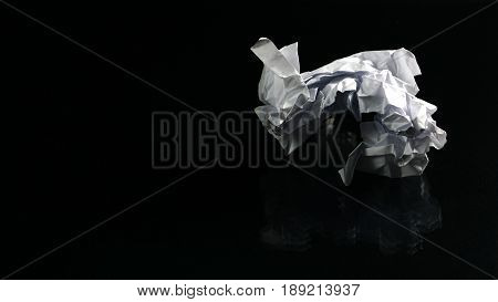 The garbage can recycle. White paper on the black mirror background