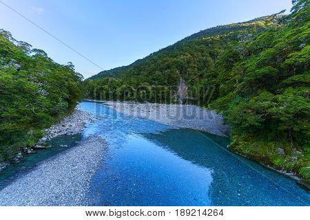 The Blue pools walking track crossing the Makarora River viewing a bridge over Blue Pools South Island of New Zealand