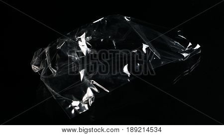 The garbage can recycle. Plastic bag on the black mirror background