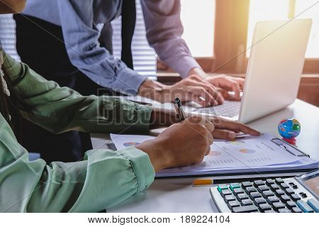 Business team meeting. Photo professional investor working new start up project.Analyzing income charts and graphs with modern laptop computer. Close up.Business analysis and strategy concept.