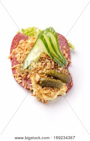 Danish specialties and national dishes high-quality open sandwich Salami with crispy fried onion remoulade and cucumber isolated on white background