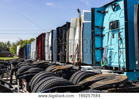 Indianapolis - Circa June 2017: Colorful Semi Tractor Trailer Trucks Lined up for Sale XII