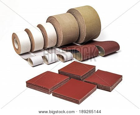 Sandpaper in Rolls and Sheets for Industrial Use in Different Sizes and Thickness on White background