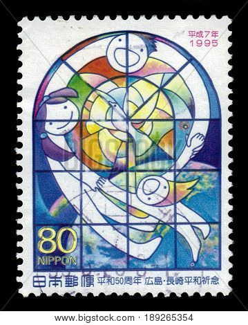 JAPAN - CIRCA 1995: a postage stamp printed in Japan showing stained-glass Light of Peace by Nobuo Suenaga, series 50th anniversary of end of Second World War, circa 1995