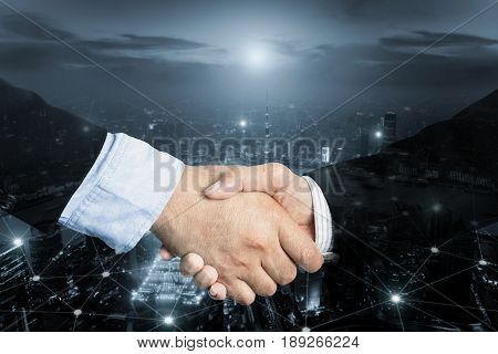 Deal or agreement business concept handshake double exposure coperation or partnership business with internet connection social on line.