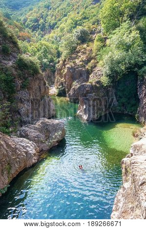 Thueyts France september 11 2016: swimmers in the river Ardeche near the devils bridge in the village of Thueyts in the Ardeche department in France