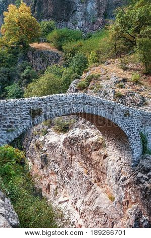The Pont du Diable or Devil Bridge is a Roman bridge that spans the river Ardeche at about 10 m altitude. The bridge is located near the village of Thueyts in the Ardeche department in France