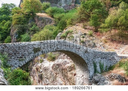 The Pont du Diable or Devil Bridge is a Roman bridge that spans the river Ardeche at about 10 m altitude. The bridge is located near the village of Thueyts in the Ardeche department in France