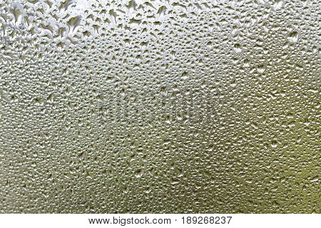 Rain drops on a glass background texture close up