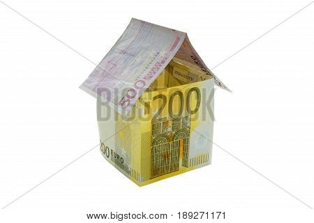 House made from euro bills isolated on white background.