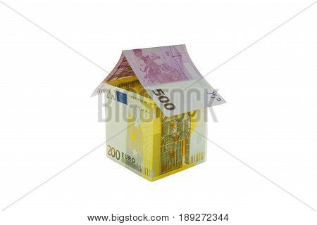 House made from euro bills isolated on white background.