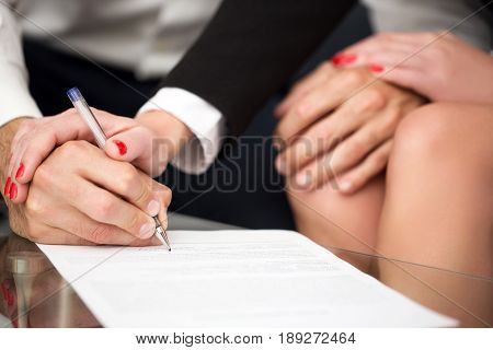 Man singning marriage settlement rich woman pulling into it