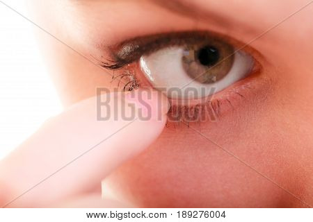 Part of face female eyes. Medicine healthcare human eye pain foreign body.