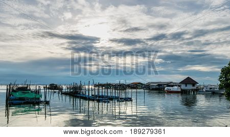 Homestay and floating basket in lake at Kohyo Songkhla Thailand with beautiful sky and clouds. This is traditional fisheries area.