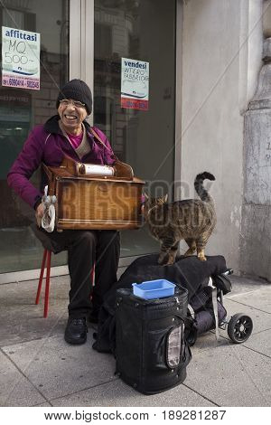 PALERMO ITALY - DECEMBER 20: Man playng music box in the Palermo street on December 20 2016