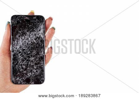 Woman hand holding modern mobile smartphone broken screen and damages. Cellphone crashed and scratch. Device destroyed. Smash gadget need repair. white background