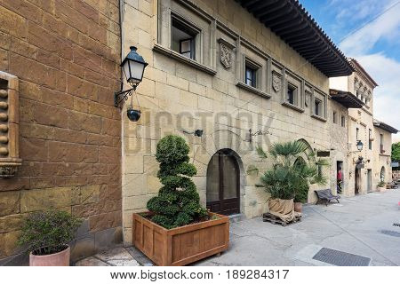 Inner yard of traditional Spanish village (Poble Espanyol) with cafes and gift shops.