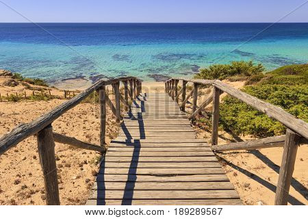 The most beautiful beaches of Italy. Campomarino dune park: fence between sea dunes,Taranto (Apulia). The protected area extends along the entire coast of the town of Maruggio.