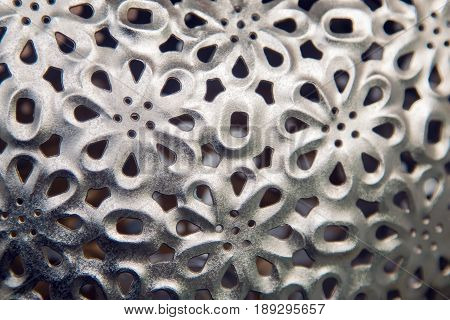 a pattern of repeated small iron flower petals