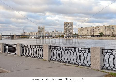 View of Neva river and Volodarsky Bridge at cloud autumn day in St.Petersburg Russia.