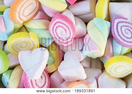 Closeup of colorful mini marshmallows with candy background or texture.