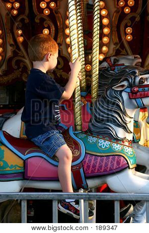 Boy Riding Carousel