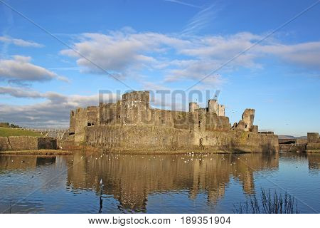 Caerphilly Castle reflected in its moat, Wales