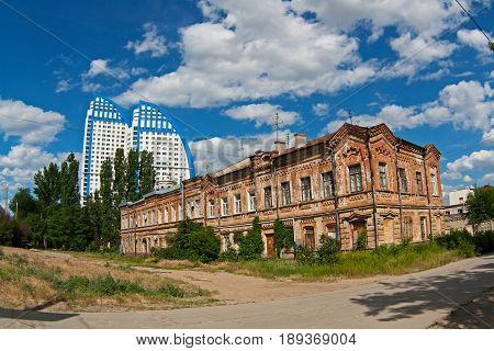 Volgograd Russia - June 11 2011: Old and classic building on Pugachevskaya Street near the new building of the 