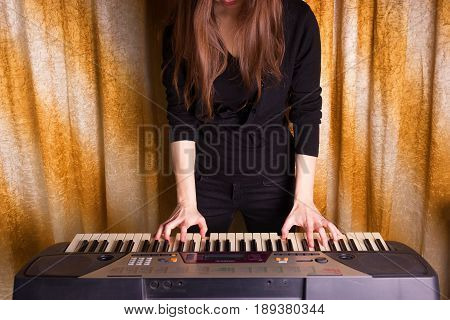 Unrecognizible Girl Musician Playing On Electronic Piano