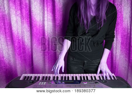 Unrecognizible Girl Musician Playing On Electronic Piano
