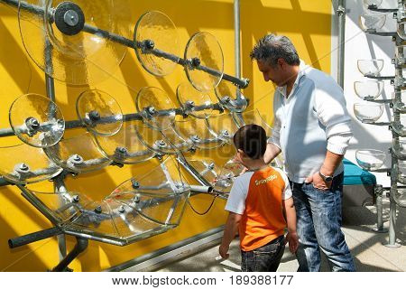 Child Making Music With Glasses