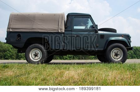 Almere Poort, Flevoland, The Netherlands - June 3, 2017: Land Rover 110 Defender 4C Diesel parked by the side of the road in the city of Almere. nobody in the vehicle